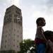 Ann Arbor residents Abigale, 4, sits on her father Rob LaMoreaux's shoulders at Top of the Park on Friday, June 21. Daniel Brenner I AnnArbor.com